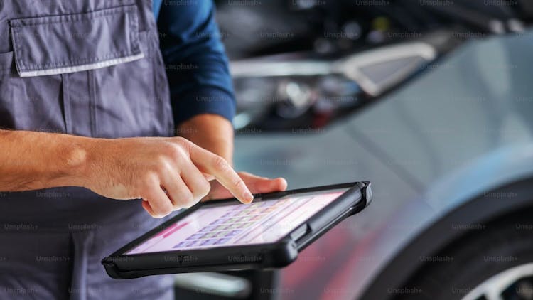 Car Technician Using a Tablet